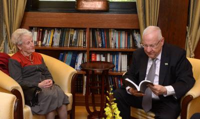 Israel&#039;s President Reuven Rivlin looks at the Yad Vashem Publication &lt;i&gt;Letters Never Sent&lt;/i&gt;, accompanied by Holocaust survivor Mirjam Bolle, who wrote the letters under Nazi occupation
